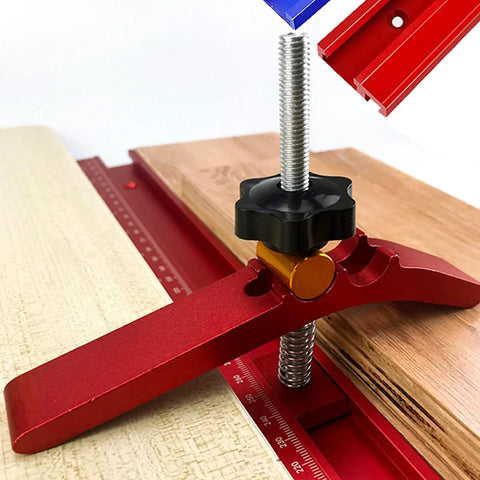 Heavy Duty Adjustable T Track Clamp With Micro Fine Tuning For Woodworking, close-up of red clamp securing wood board.