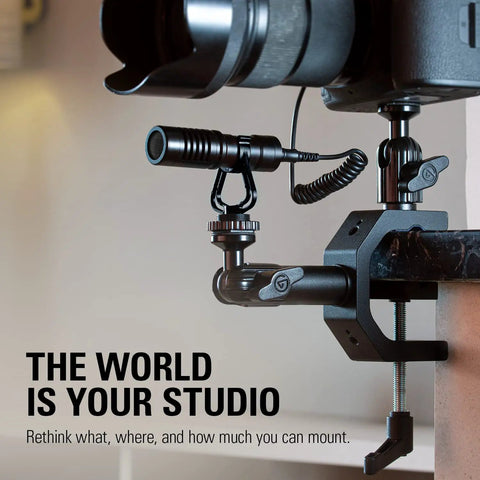Close-up of Heavy Duty Aluminum Camera And Lighting Mount Featuring Adjustable Ball Head securing a microphone and camera on a desk.