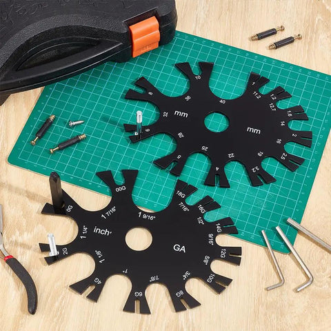 Acrylic Gauge Wheel Ring Sizer And Body Jewelry Checker Tool With Dual Inch And Metric Scale Chart on a workbench.