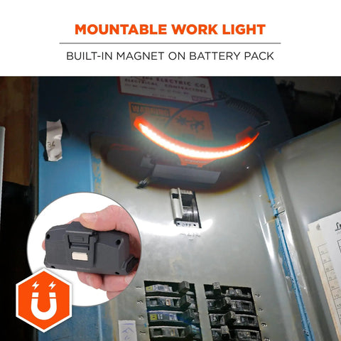 Hand holding Skullerz 8886 Wide Beam Headlamp with hard hat mount and power bank, shown mounted on a metal surface.