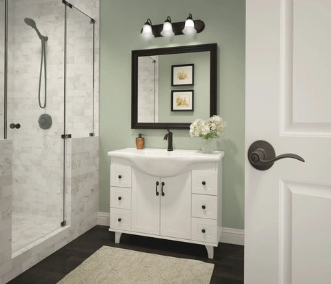 Bathroom with shower, vanity, and accent door lever for hall and closet passage lock in aged bronze, easy install handle.