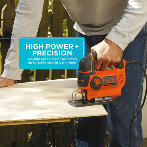 Man using Powerful 5 Amp Corded Jig Saw With 3000 Bpm Blade Speed, Three Quarter Inch Orbital Action for precise woodcutting.