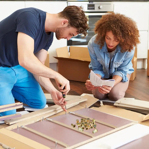 Two people assembling furniture using 500 Piece Rivet Nut Kit Carbon Steel Threaded Inserts Galvanized Set for Home Projects.