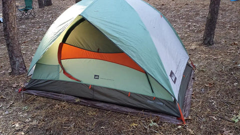 Tent covered by Heavy Duty All Purpose Poly Tarp 25 By 40 Ft 5 Mil Waterproof Reversible Brown And Green Outdoor Cover.