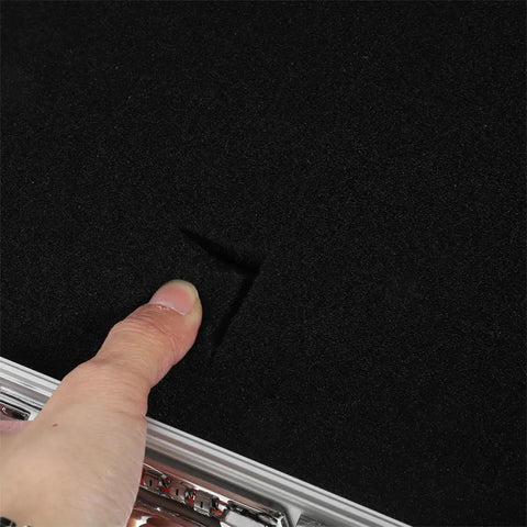 Tough As Nails Aluminum Tool Chest With Comfortable Grip Handle And Solid Metal Latch Portable Hard Storage Case For Go Everywhere Outdoor Excursions And Projects showing soft interior foam with finger impression.