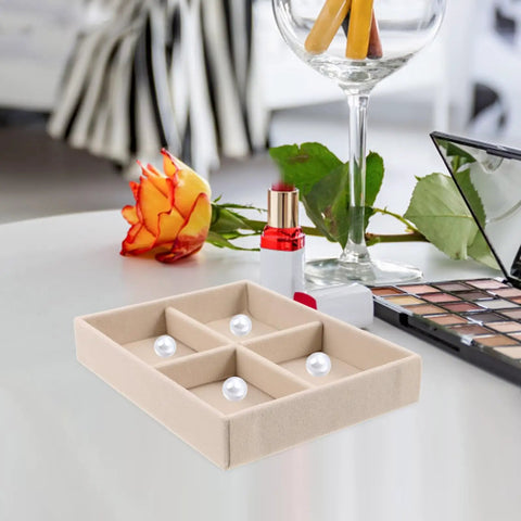 Beige Velvet Jewelry Display Tray With Four Grids And Sturdy Wooden Lid For Ring Bracelet Earring Storage Stackable Vanity Organizer on a table.