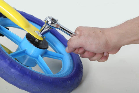 Using heavy duty socket wrench set with one half inch drive ratchet from 120 piece auto repair tool kit on bicycle wheel