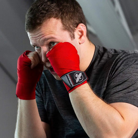 Premium Gym Grade Four Way Stretch Boxing Hand Wraps In Black With Top Shelf Wrist Support and Iron Knuckle Coverage For Hard Bag Work and Sparring Drills At 180 Inches Long.
