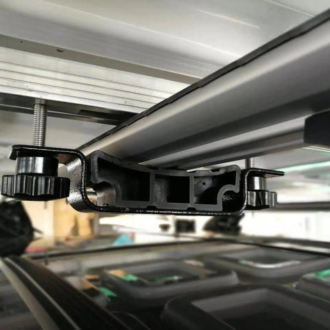 Close-up of Rooftop Tent Brackets Spare Part Kit for Quick Release Mounts installed on a roof rack, showing metal construction.