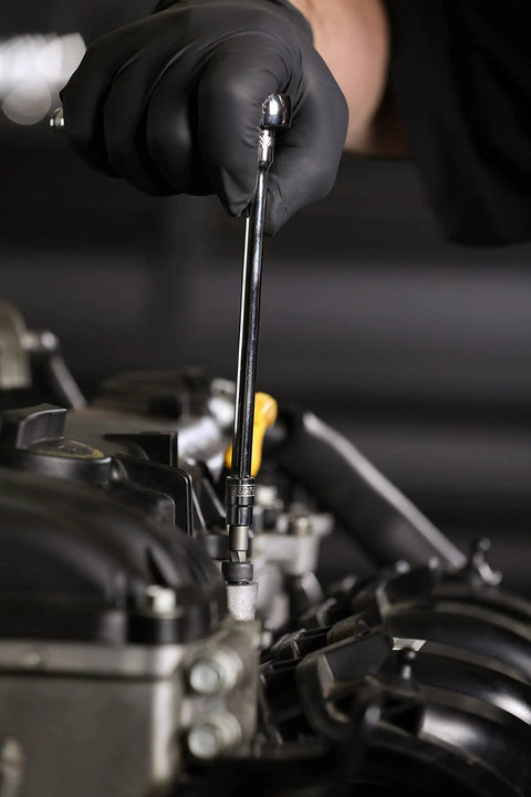 Person using Heavy Duty 14 Piece Metric Damaged Fastener Remover Hex Bit Socket Set on automotive engine part.