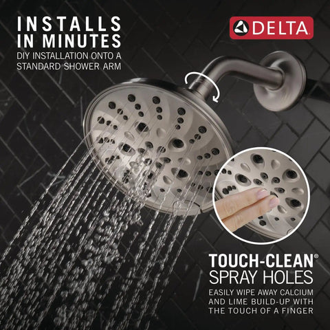 Universal Showering Components Showerhead With Lumicoat Stainless Finish spraying water in a bathroom with touch-clean spray holes