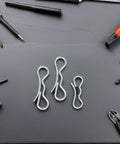 Cotter Pin Assortment Kit With Bow Tie Locking Clips And Heavy Duty Trailer Hitch Pins among tools on black surface