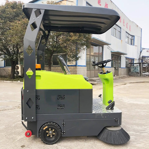 Side view of Top Rated Industrial Floor Sweeper Machine, a heavy duty ride on scrubber for efficient warehouse cleanup.