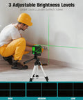 Laser Level With Tripod And Rotary Green Cross Line 100 Ft Self Leveling Laser Tool For Indoor Outdoor Construction And For DIYers 110 Degree Coverage For Precise Alignment And Fast Reliable Results. worker setting green cross-line laser level on tripod indoors