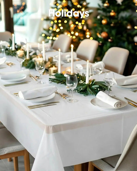 No Sweat Heavy Duty Disposable Tablecloths White 8 Pack 54 By 108 Inches on a holiday dining table with decor.