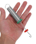 Hand holding a steel coil from the 10 Pack Spiral Spring Kit for Physics Experiments Hooke's Law Teaching Tools Reliable Compression Springs Assortment