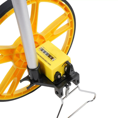 Sonew Mechanical Measuring Wheel – 9999.9m Distance Measuring Wheel with yellow wheel and counter mechanism close-up.