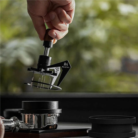 Top Shelf 58Mm Needle Distributor And Wdt Espresso Tool in use, adjustable height, stainless steel ground prep kit with cleaning base.
