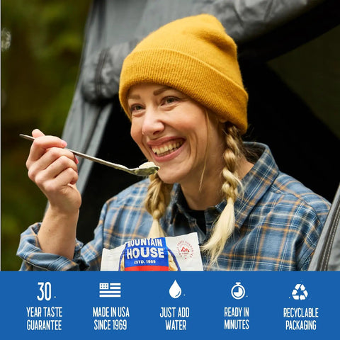 Person enjoying Gluten Free Korean Inspired Beef Freeze Dried Trail Ready Camping Meal For Backpackers 12 Servings 30 Year Shelf Life