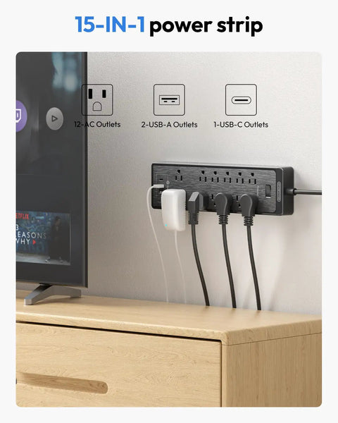 15 Ft Extension Cord Flat Plug Surge Protector Power Strip With USB, 12 Outlets, Wall Mount, in use beside a TV.
