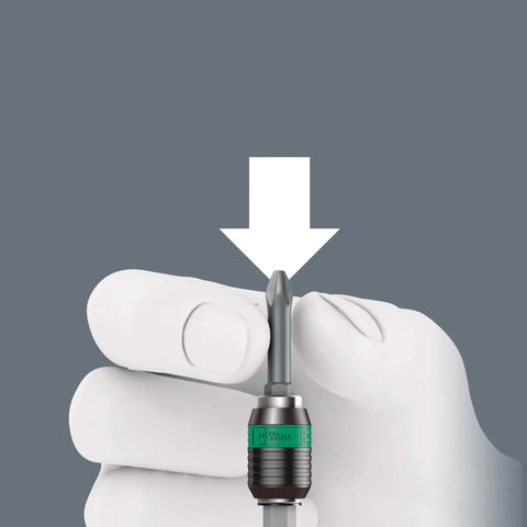 Holding a bit from the Kraftform Kompakt 400 RA 17-Piece T-Handle Ratcheting Bit Set With Built-In Ratchet And Reversible Drive.