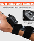 Close-up of Wrist-X Golf Swing Training Aid with audible click feedback on wrist, 0-70 degrees adjustable hinge.
