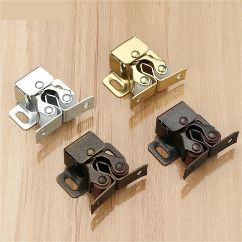 Four metal Magnetic Cabinet Catch And Door Stopper Kit for Wardrobe And Furniture Hardware in silver, gold, and bronze on wood surface