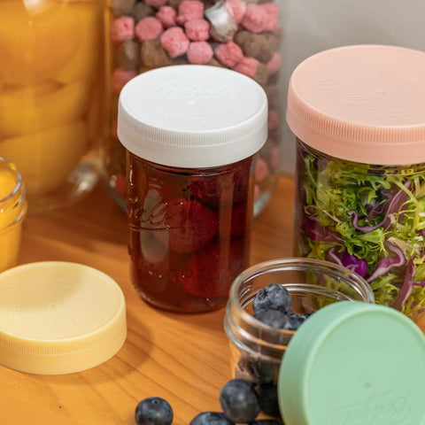 16 Pack Gray Plastic Mason Jar Lids One Piece Tight Seal No Silicone Washers Needed, showcasing jars with sealed food.