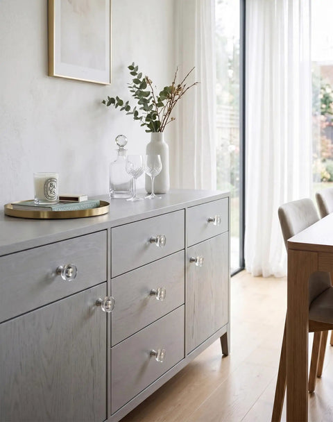 Glass Cabinet Knobs Set Of Eight In Silver With Clear Crystal Ring on dresser showing modern chic acrylic hardware detail