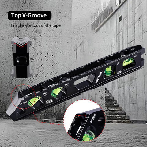 Pro Grade 9 Inch Magnetic Torpedo Level Featuring Four Crisp Bubble Vials and Wide V Groove Channel on concrete surface.