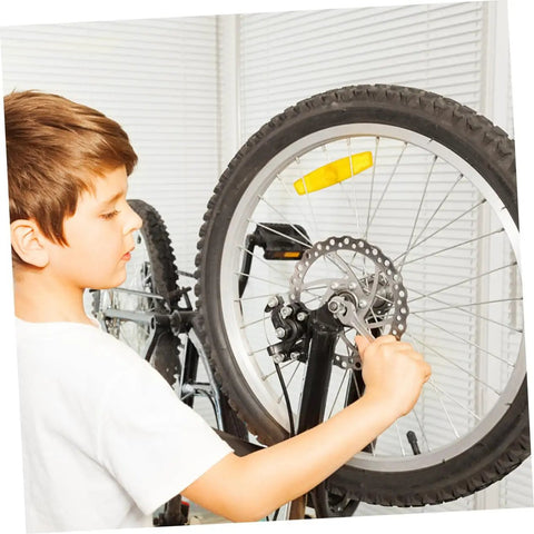 Child adjusting Heavy Duty Mountain Bike Disc Brake Kit With Front And Rear 160Mm Rotors Mechanical Caliper in a garage.