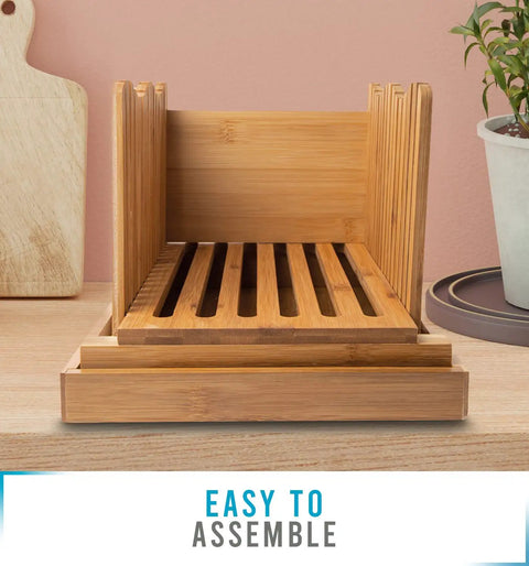 No Mess Bamboo Bread Slicer For Homemade Loaves Adjustable Foldable Bread Cutter with Crumble Tray on a kitchen counter