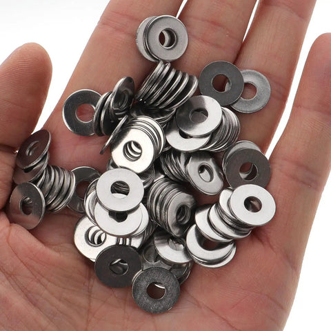 Hand holding stainless steel washers from Stainless Steel Carriage Bolt Nut And Washer Kit 10 Sets 304 Grade High Strength Fasteners