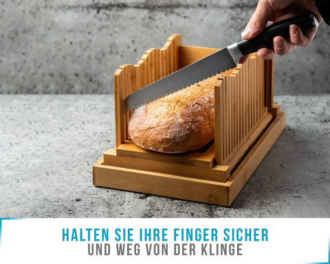 No Mess Bamboo Bread Slicer For Homemade Loaves Adjustable Foldable Bread Cutter With Crumble Tray in use with knife slicing bread