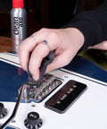 Person cleaning a guitar bridge with a microfiber cloth, using Complete Guitar Care Kit And Clean Polish Set With Fretboard Conditioner.