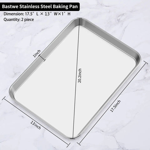 Dimensions of a stainless steel baking pan, 17.5x13x1 inches, part of 18 Inch Stainless Steel Baking Sheets Set Of 2, on marble surface.