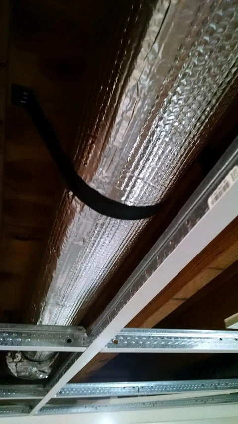 Top Shelf Extra Thick Double Bubble Reflective Foil Insulation Roll installed on air duct in ceiling, measuring 72 x 125 inches.