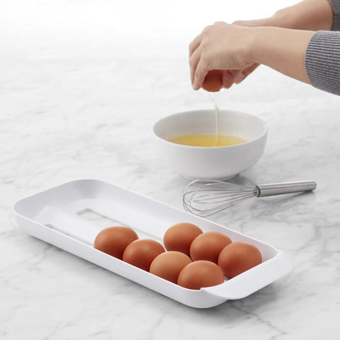 Rolling Egg Holder Organizer For Fridge, BPA-Free Stackable Dispenser With Removable Tray, Holds 12-14 Eggs, see-through on counter