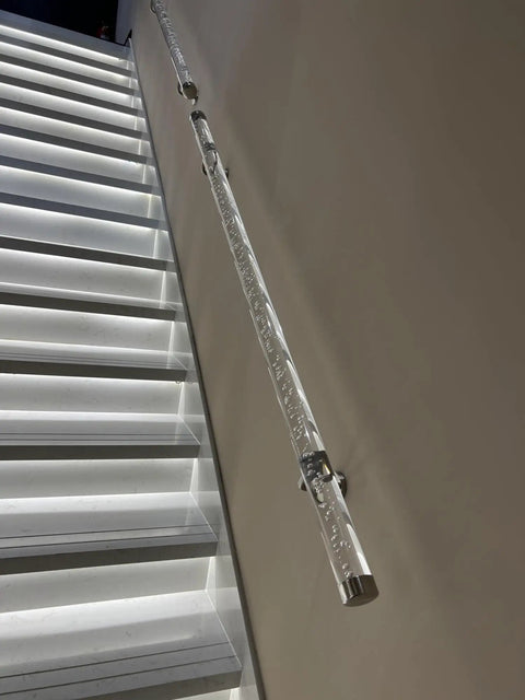 Hella Durable Acrylic Round Grab Handle With Rock Solid Metal Brackets Straight Up Secure Indoor Outdoor Wall Mount Safety Railing silver coated non slip grip on a staircase.