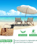 Beautiful beach scene with heavy duty beach umbrella sand anchor and metal stand securing umbrella, showcasing rust-proof and lightweight features.