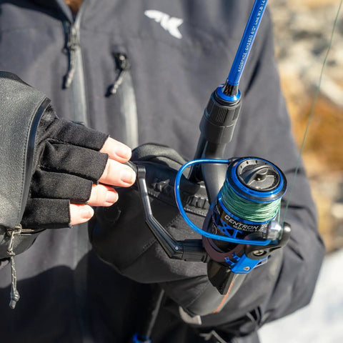 Angler holding Centron Spinning Reel Size 500 with Ultra Smooth Drag Up To 17.5 Lbs, CNC Machined Aluminum Spool, outdoors