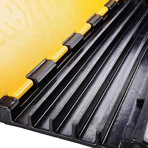Detail view of Tough As Nails Rubber Cable Protector Ramp Five Channel Wire Cover 36 Inches Long, showcasing black rubber channels.