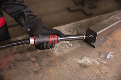 Heavy Duty Straight Air Die Grinder Featuring Top Shelf 22000 Rpm Power And A One Quarter Inch Collet in use on metal work surface.