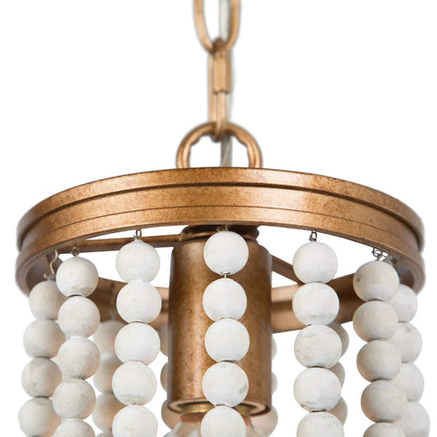 Close-up of Beaded Chandelier Farmhouse Pendant Light with antique gold finish and white wood beads for dining room foyer bedroom or kitchen.