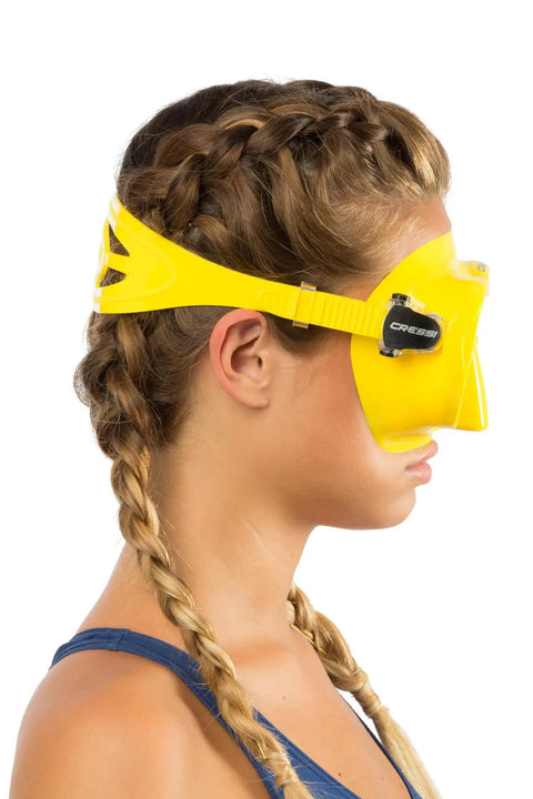 Side view of a woman wearing a yellow Frameless Snorkel Mask Kit With Dry Top Snorkel Ultra Clear Lenses Low Volume Design