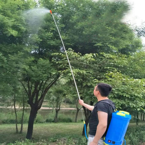 Person using Retractable Stainless Steel Sprayer Wand Extension Pipe Tool For Garden Farm And Horticulture Use Portable Sprayer