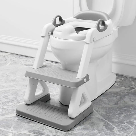Super Secure Toddler Potty Ladder And Training Seat With Memory Foam Cushion Non Slip Base Fits All Standard Toilets on bathroom floor.