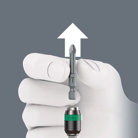 Hand showing bit removal from Kraftform Kompakt 400 RA 17-Piece T-Handle Ratcheting Bit Set With Built-In Ratchet And Reversible Drive
