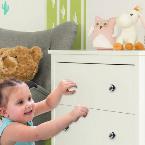 Four Pack 1.37 Inch Round Cabinet Knobs With A Slick Marble Texture Black Finish Kitchen Cupboard Handles, child reaching for white dresser.