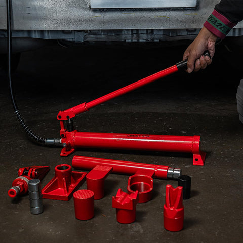 10 Ton Hydraulic Porta Power Jack Ram Badass Auto Body Frame Repair Tool with red hydraulic ram and attachments on workshop floor.
